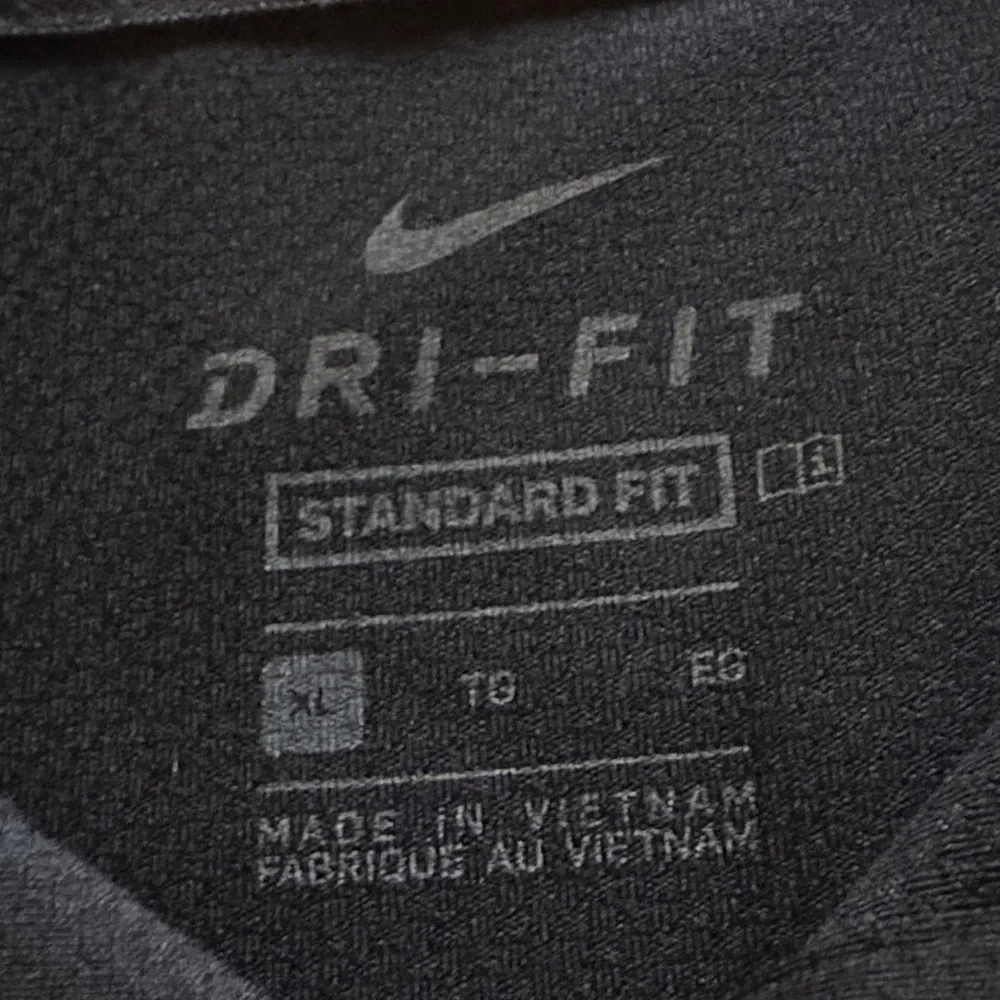 Nike Men's Black Polo Shirt with White Accents - Picture 6 of 7